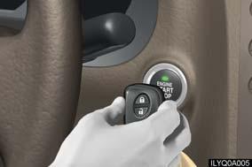 [10 mm]), making sure that the button side of the key is facing toward you. Press the engine switch within 5 seconds after the buzzer sounds, keeping the brake pedal depressed.