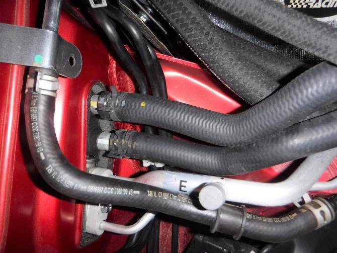 Install the shorter hose that s attached to the metal tubing to the firewall fitting toward the engine side as shown in Photo 3-9. 9.