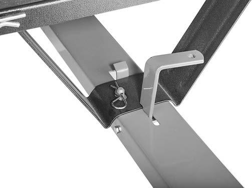 10. Insert cotter pin into plate behind release bar on trailer tongue (see Figure 10). Note: Pin prevents cart from pivoting up and dumping its load. Remove pin to dump contents.