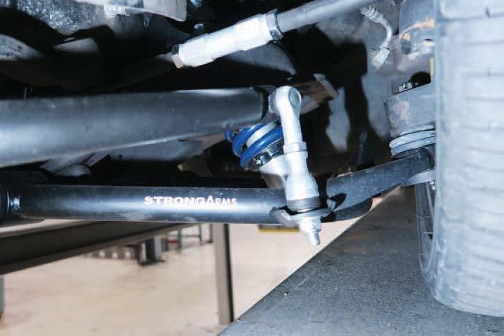 5. MuscleBar Installation 5. Install Bushing Straps Over the Poly SwayBar Bushings. 6. 7. 6. Hold the SwayBar into position on the truck with the SwayBar arms below the tie rods.