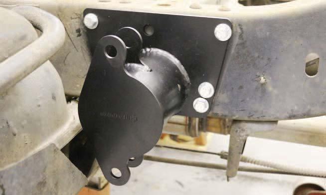 Sit an Upper Bar Mount on top of the axle with the locating pin into the center hole of the leaf spring pad.