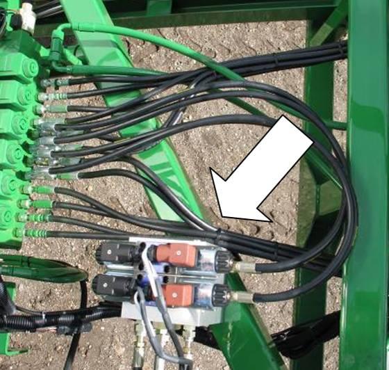 9.2 Valve Block Mounting 1. A good mounting location for the valve block on the John Deere is illustrated in Figure 27. 2. Insert the threaded rod into the block and use a hex nut to hold the rod.