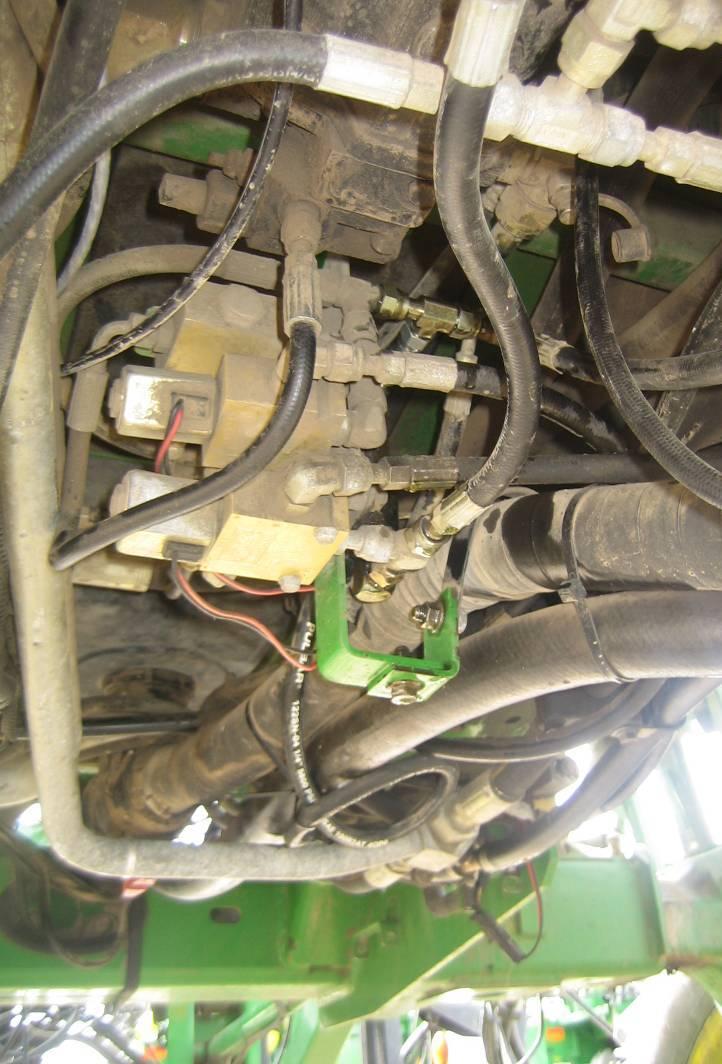 There are multiple versions of JD load sense blocks on sprayers. Choose the picture that most closely resembles your sprayer valve block and tee in accordingly.