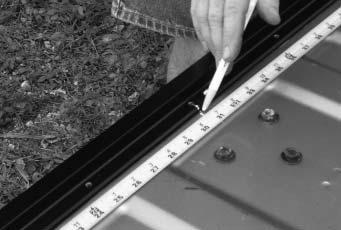 (Photo 10). Track Housing E. Use #10-24 x ½" truss head screws and Cargo Nuts to secure the Tracks to the Housing Stems (Photo 11).