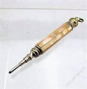 Price: $105. #2 Gold, most likely 9 kt. with etched pattern. Measures 2-1/2" closed and 4-1/2" open, Propels and retracts the lead. Sturdy pencil. Price: $125. #3 Very much like pix on right.