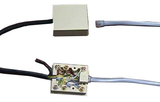 Attach the six conductor flat cable pig-tail between cable adapter and the COM port connector on the circuit board in the load center.