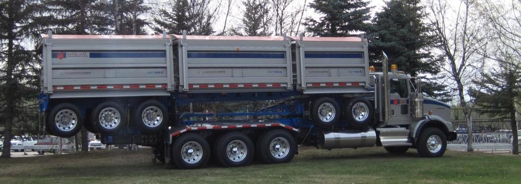 Figure 2. Quint-axle trailer(ore) stacked on truck when empty 2.