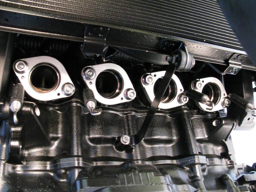 springs and sleeves onto the cylinder head, using stock