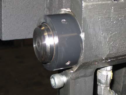 Tighten both the left and right hydraulic fittings to 21 ft-lbs.
