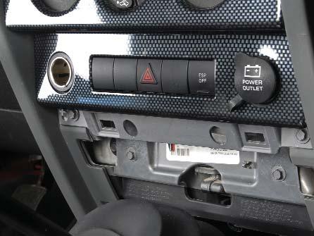 DVD Headrest JK Wrangler Installation Instructions 13. Gently pry off the plastic Fascia Panel that s in front of the gear shifter and just below the lower bank of switches as shown.