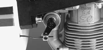 Insert the throttle pushrod in the pushrod tube. Insert the Z-Bend in the throttle servo horn. Position the throttle servo in the fuel tank compartment.