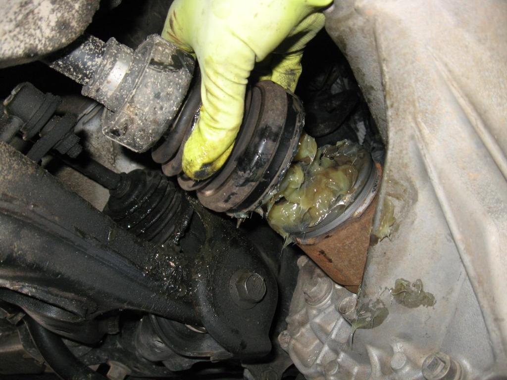After the joint is repacked, slide the boot back over the housing on the transmission.