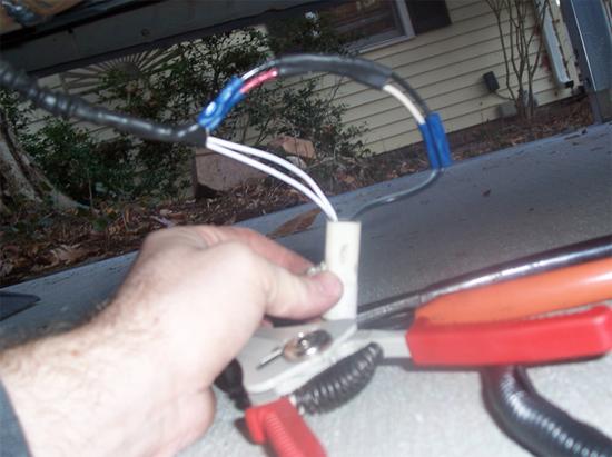 9. Use your wire stripper to take about a quarter inch of the cover off of the end of each black and gray wire (4 total, now that they ve been cut).