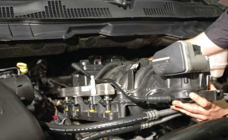 37. Lift up slightly on the OEM intake manifold, and pull