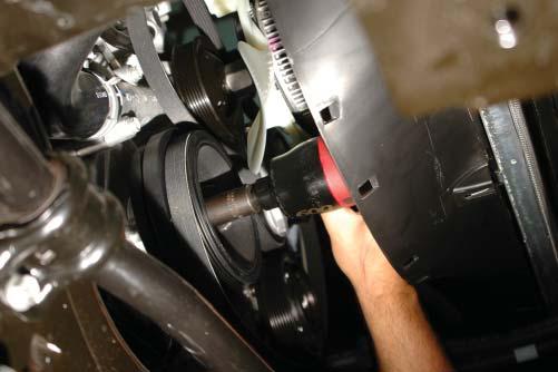 Remove the crank pulley mounting bolt using a 21mm impact socket, and an impact gun. 67.