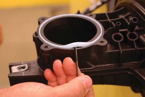 81. Remove the stock throttle body gasket ring from the OEM intake