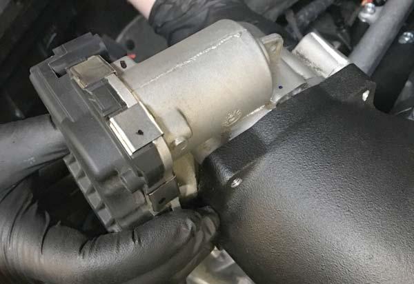97. Reinstall throttle body with motor assembly on top as shown using the provided M6 x 40mm