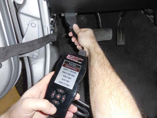 The fi rst step of the installation is to connect the SCT X4 tuner to the OBDII port for calibration of your system to function with the supercharger.