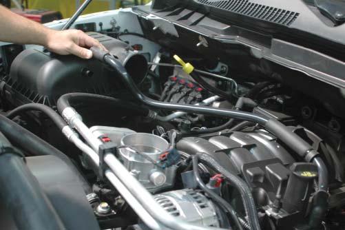 Unplug the PCV tube running over the OEM intake manifold at the