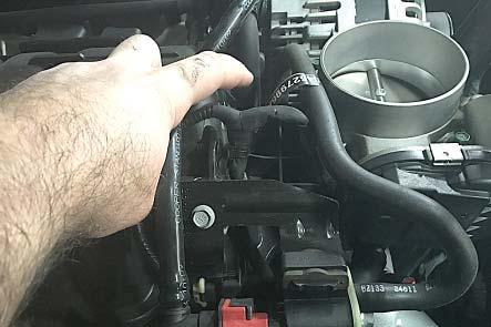13. Remove the EVAP hose from the hose barb behind the throttle body on the right side of the