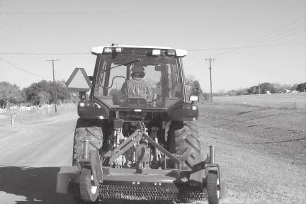 OPERATION Make sure that all tractor flashing warning lights, headlights, and brake/taillights are functioning properly before proceeding onto public roads.