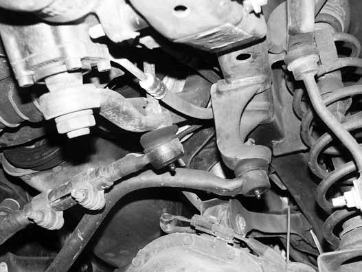 Remove the driver s and passenger's side coil spring retainer clip located on the back side of the axle coil seat. Save clips and bolts. 9.