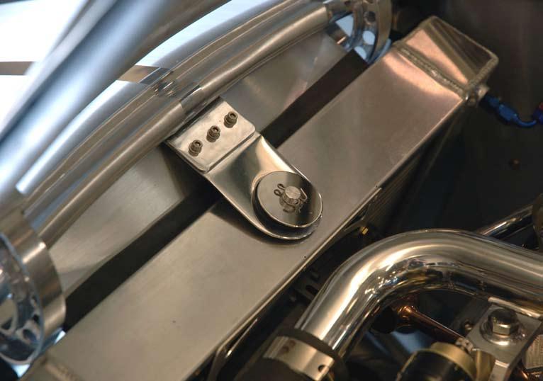 The upper radiator bracket and mounting system is identical