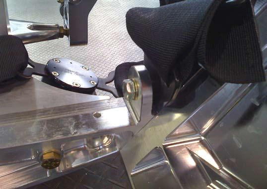 The inboard seat-belt anchor has a rib that