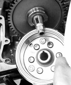 Install the flywheel, washer and tighten the nut.