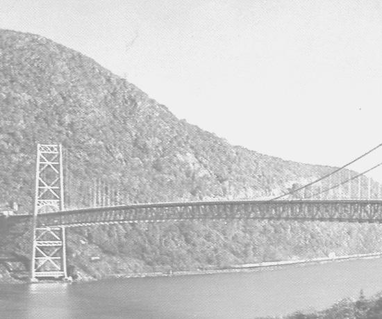Its overall length is 3, feet, the main span measures 1,5 feet, and its clearance above river is 135 feet. This is a parallel wire cable suspension bridge, with suspended side spans.