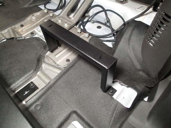 Remove rear seat bracket nuts only.