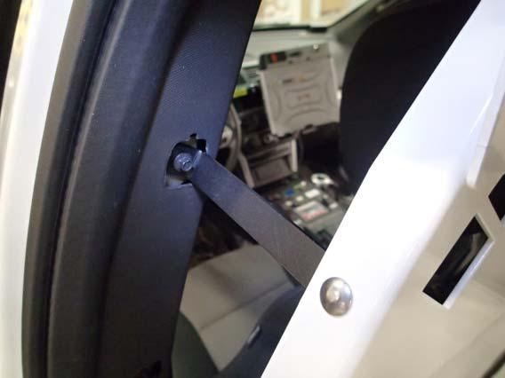 Loosely attach lower passenger side C shape bracket to B pillar grab handle