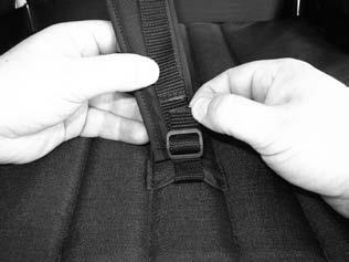 5) At the top edge of the back rest, fasten the hook-and-loop closure on the padding (Fig. 34b, Pos. 1).