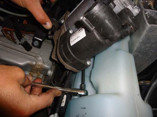 Do not remove the air fitting from the air suspension compressor.