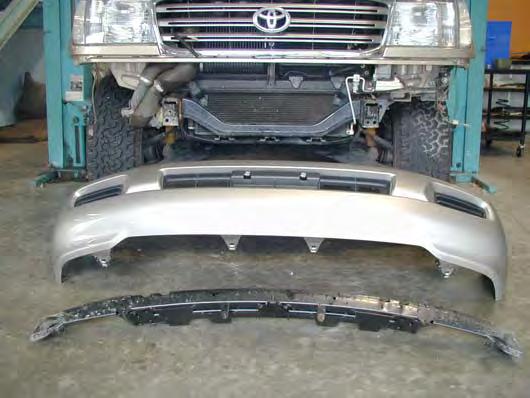 1. Remove the bumper bar and grille from vehicle. 2. Remove the cross member bracket and tow brackets and tie downs.