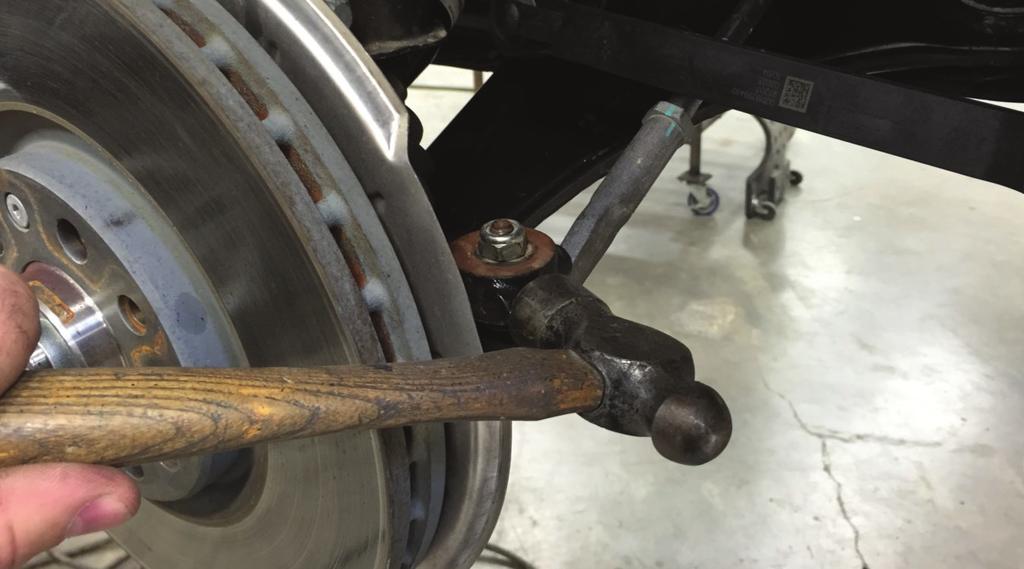 12. Disconnect the tie rod from the steering knuckle.