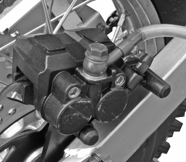 A brake system with air will cause the hand brake lever and foot lever to feel soft and spongy. Use the instructions below to bleed air from both the front and rear brake systems. 1.