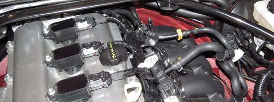 Remove the EVAP solenoid from the intake manifold by disconnecting the