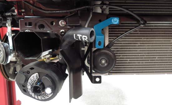 Reinstall the passenger side radiator shroud with the LTR support bracket using the factory