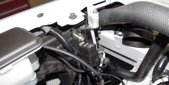 108. Using the factory bolt, mount the water pump harness relay to the passenger side of the