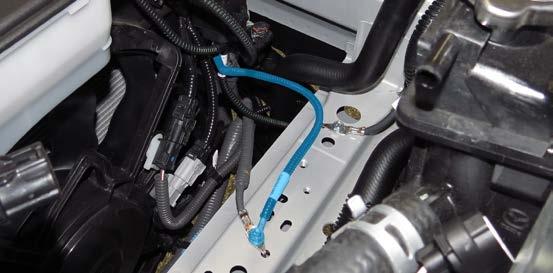 Route the power wire and EVAP/engine wires behind the engine coolant reservoir and over to where