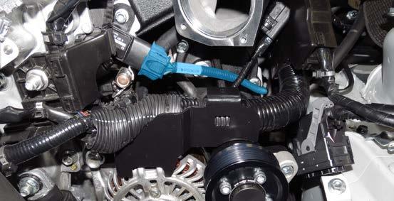 Route the MAP sensor harness (installed during step 68) around the driver side of the