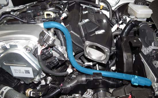 114. Install the valve cover breather hose onto the valve cover then route the