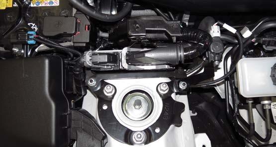 Secure the ECM mounting bracket to the vehicle with the remaining nut and bolt removed during step 23.