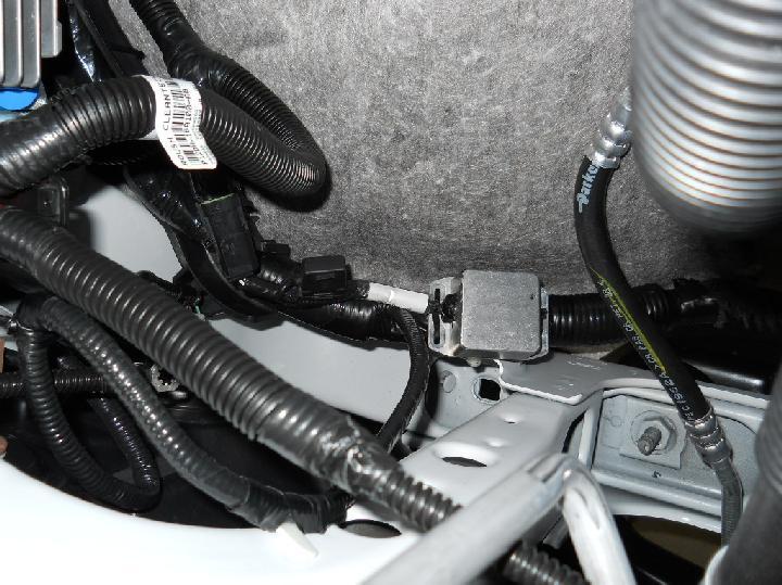 Note: The SRM connector must be oriented downward for proper harness installation. Figure 15.1. 3. Position the fuse box (part of harness) onto the bracket and slide it in until locked in place.