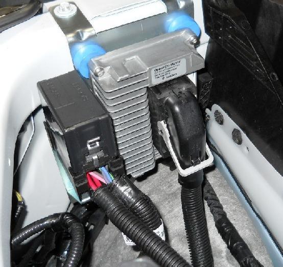Plug in the fuel level interface module (FLIM) connector (and in-line fuse) to the underhood harness FLIM connection. Use two zip ties to secure the FLIM to the OEM wiring harness as shown.