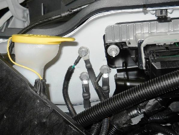 Connect the underhood harness ground eyelets to the existing Ford ground location on right side next to the PCM. Figure 16.1. 9. Install five cable tie edge clips to the top of the cowl area as shown.