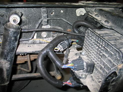 terminates. Figure 18.1. 2. Connect the rear harness to the underhood harness and zip tie to the vehicle harness. Figure 18.2. Continue to route the rear frame harness along the OEM vehicle harness and lines to the rear.