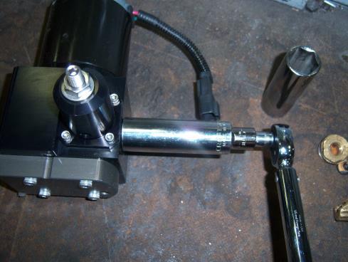 Then take the torque wrench with a 7/8 deep socket attached and torque the fitting to 180in-lb or 15ft-lb.