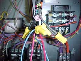 23. Secure the fuse holders to the compressor wire bundle located below and to the left of the terminal block using the wire ties provided. 24. Tie any loose wires together in the compressor section.